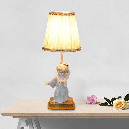 Elegancka lampka nocna anioł